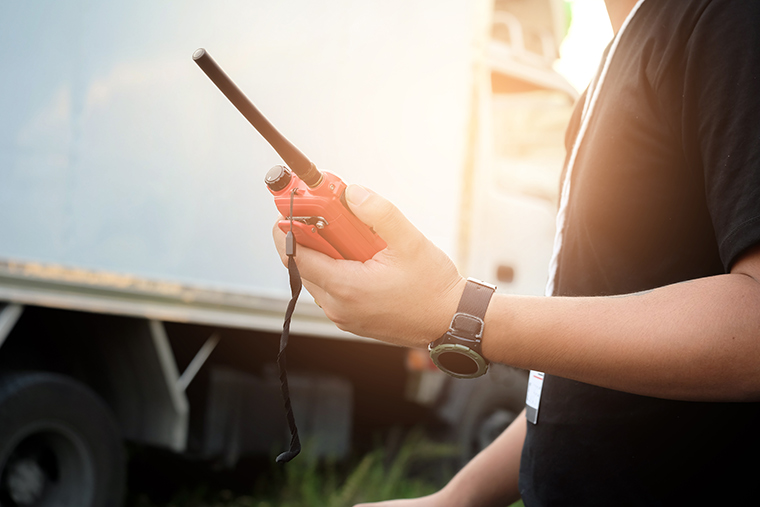 Close-Up of Person Using Two-Way Radio