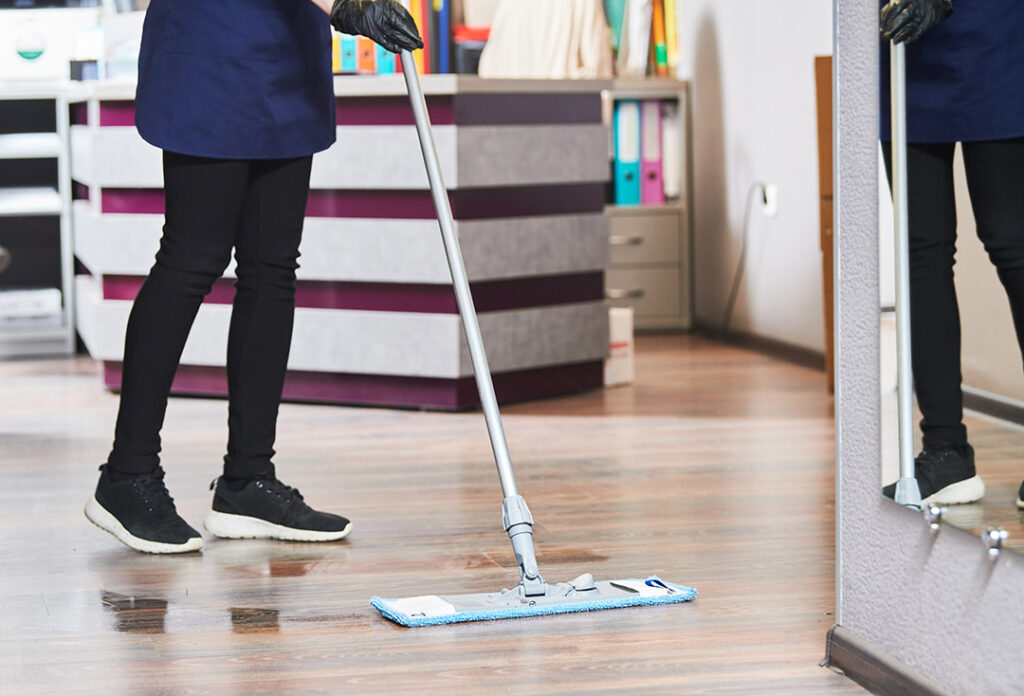 Person cleaning the floor