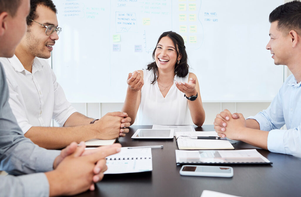 Cheerful Business people,communication and meeting in office with paperwork for budget review.